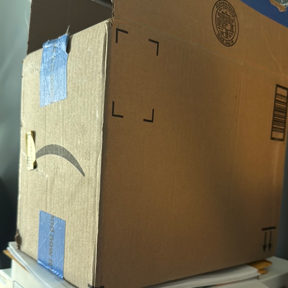 Cardboard Box with Blue Tape
